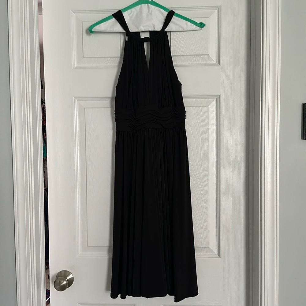 Whit house black market dress. All black with halter style top and zipper back.